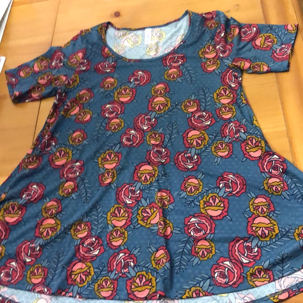 LuLaRoe Perfect T size Medium Roses on a blue background